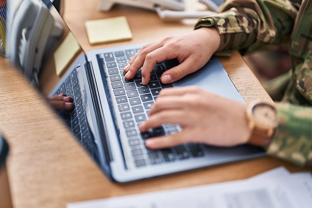 Service member working on laptop