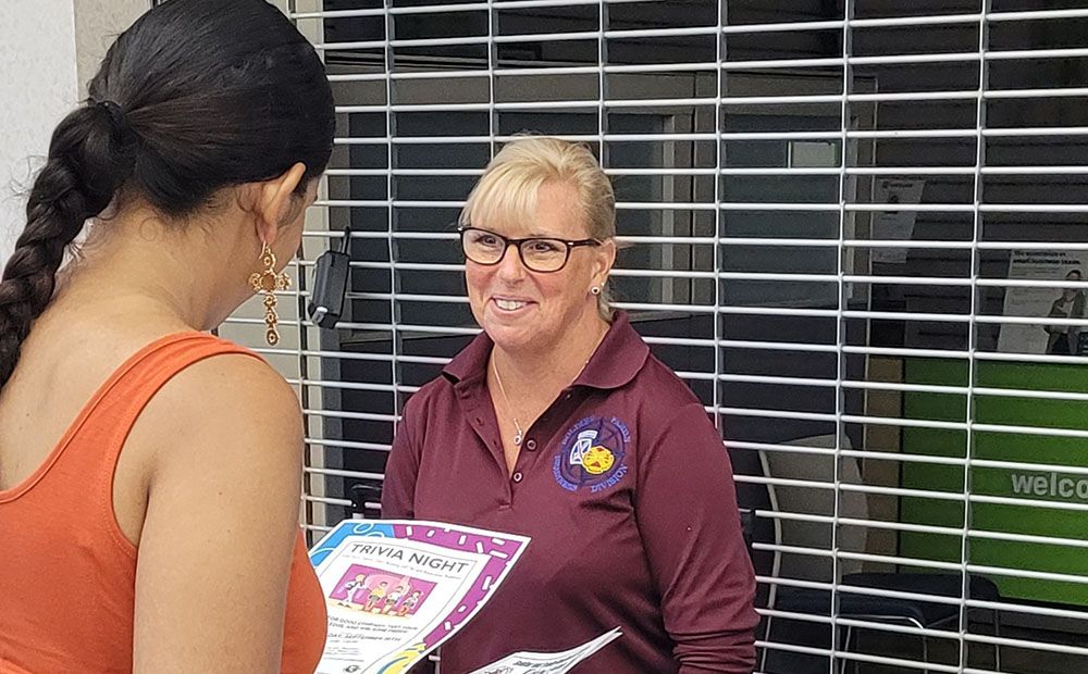 Volunteer talking with someone